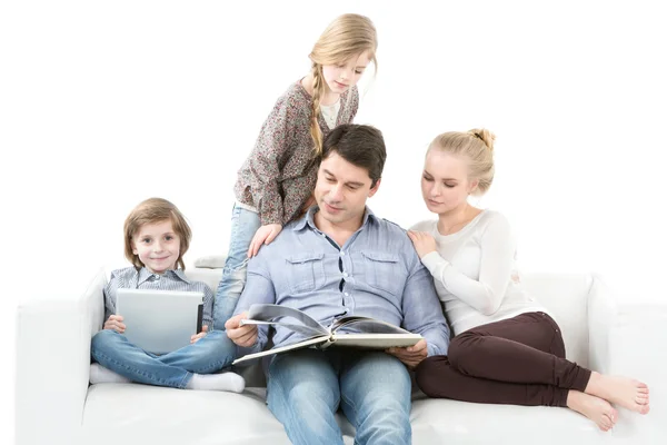 Happy family reading a book. Family Education.