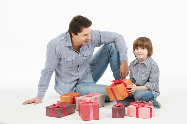 Father gives gifts to his son.