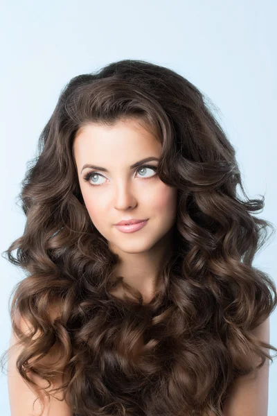 Hairstyle. Woman with wavy hair.
