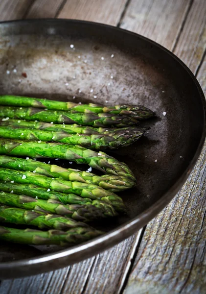 Close-up of asparagus on frying pan