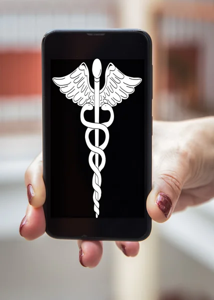 Mobile concept healthcare and medicine: Woman hands with signs o