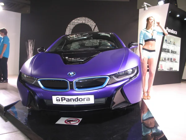 Pandora and BMW. The girl from the BMW team works on exhibition. Moscow International  Auto Show 2016