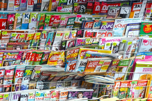 Stand with the press. Magazines, newspapers. Huge selection, variety