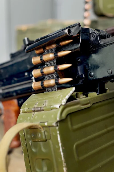 Machine guns and boxes of ammunition