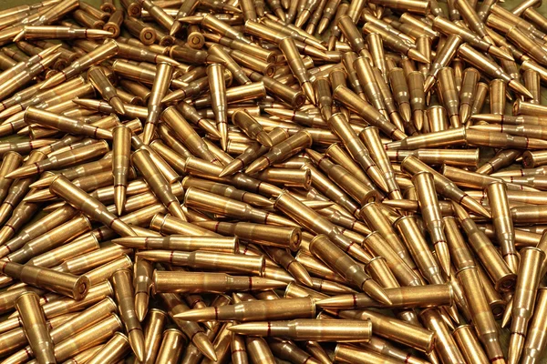 Background from military machine gun cartridges. Danger concept.