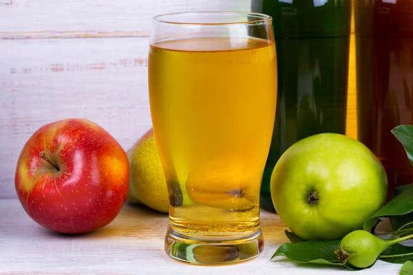 Glass and bottles of cider