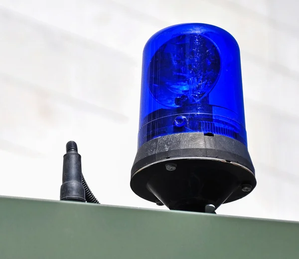 Blue light and siren of the military ambulance