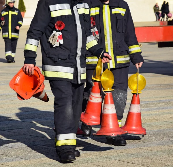 Firefighters with traffic cones