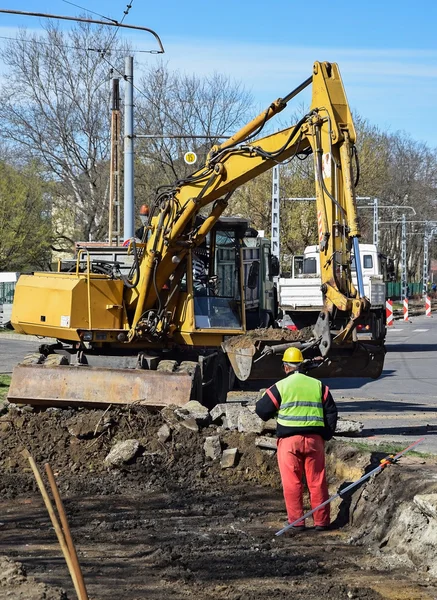 Excavator is working at the road construction