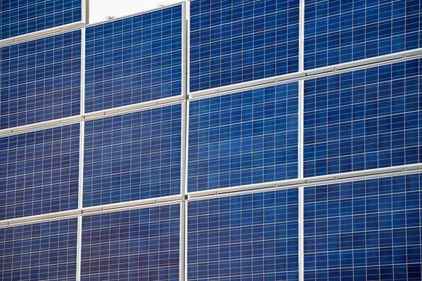 Solar panels on the wall of an office building