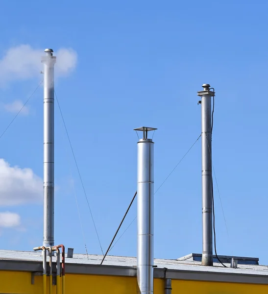 Metal smoke stacks of a factory