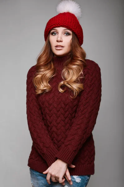 Portrait of beautiful redhead woman in sweater