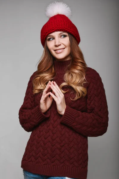Portrait of beautiful redhead woman in sweater