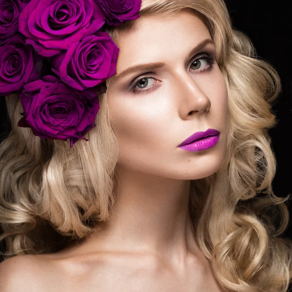 Beautiful blond girl in dress and hat with roses, classic makeup, curls, red lips. Beauty face.