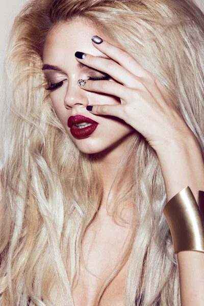 Beautiful sexy blonde girl with sensual lips, fashion hair, black art nails. Beauty face.
