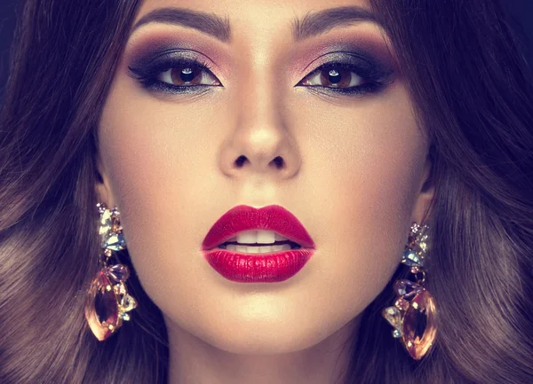 Beautiful woman with arabic make-up, red lips and curls. Beauty face. Insta Color