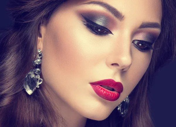 Beautiful woman with arabic make-up, red lips and curls. Beauty face. Insta Color