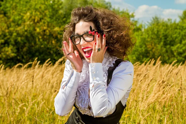 Beautiful woman in glasses having fun outdoors