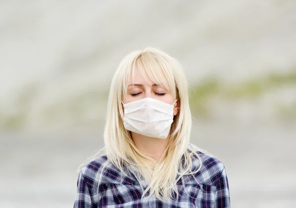 The woman in respirator. Protection against viruses.