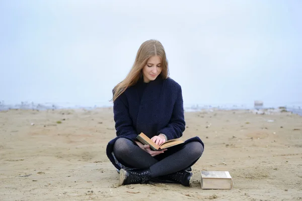 The girl reads the book