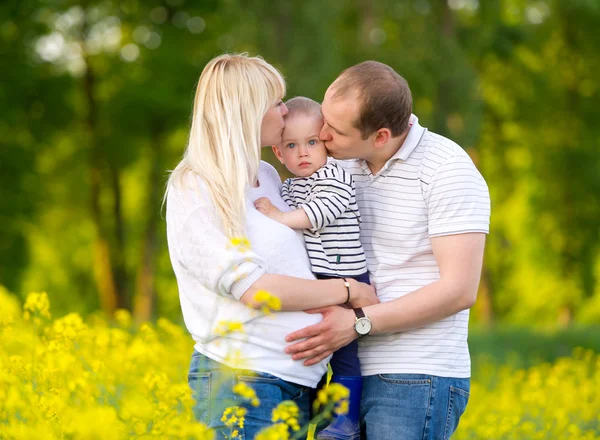 Happy family - mother, father and the little son