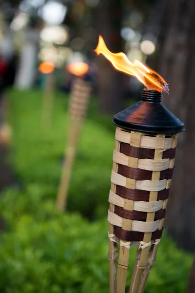 Bamboo torch lit