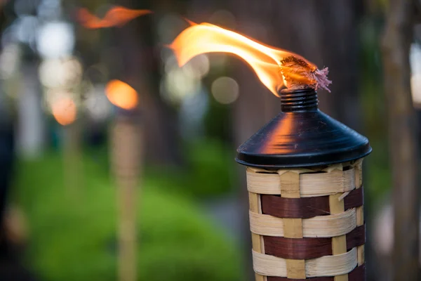 Bamboo torch lit