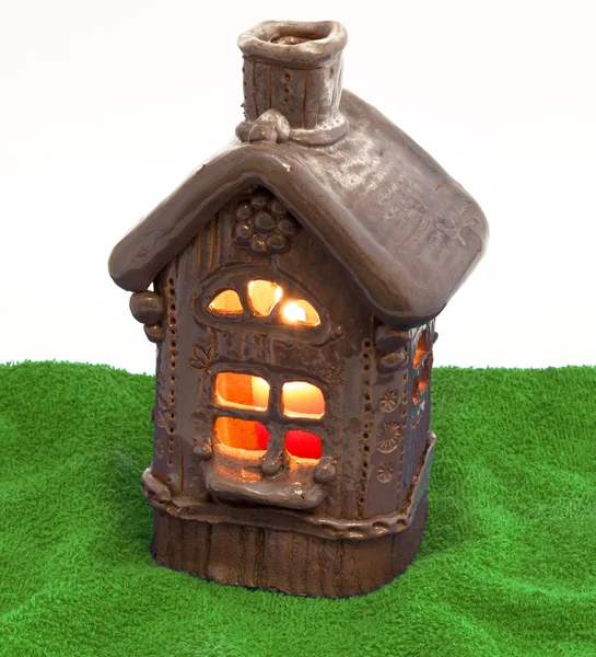 Small gingerbread house on grass