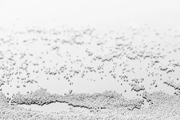 Abstract silver background with metal particles.