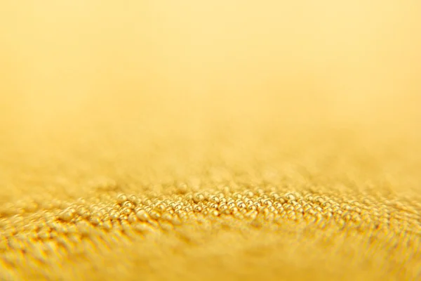 Abstract sparkling gold background with gold balls. Background.