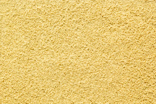 Abstract gold background with gold metal particles .