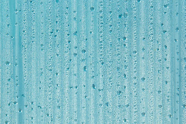 Water drops on the background. Condensate. Mint color background. Water drops background.