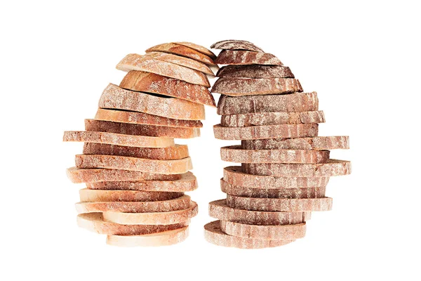 Two pile of slices of black rye bread and white bread with a crispy crust on a white background.  Isolated. Concept art. Food background.