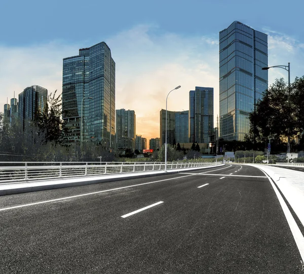 Asphalt road High way with city background