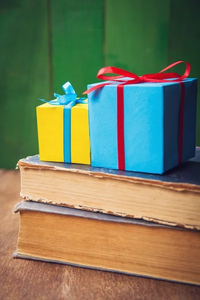 Two present boxes on old book