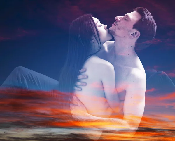 Double exposure of couple portrait cuddling and sunset