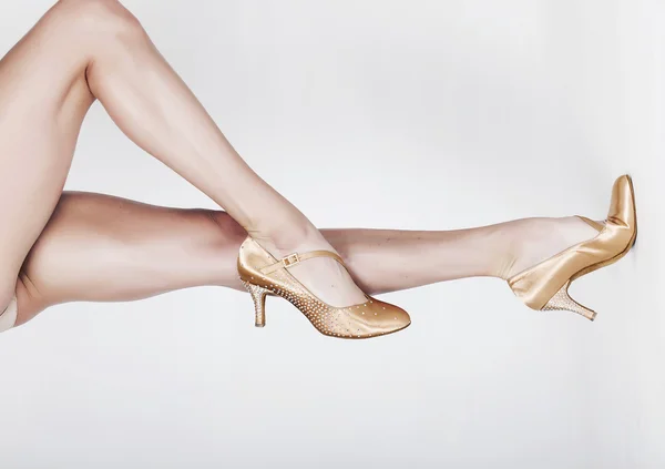 Beautiful dancer legs wearing ballet shoes horizontal