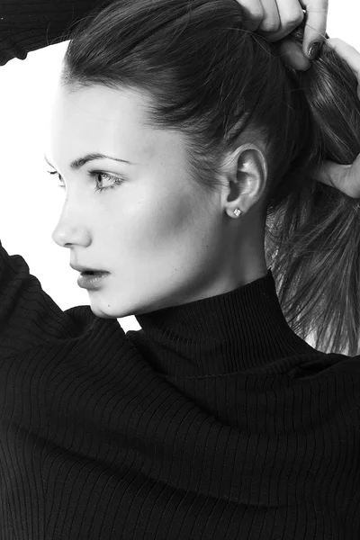 Gorgeous woman closeup portrait wearing sweater black and white