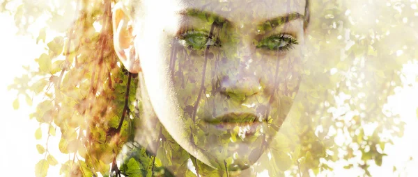 Double exposure of beautiful girl and green leaves letterbox