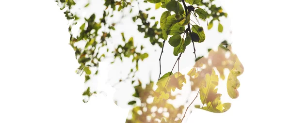 Double exposure of girl profile portrait and green leaves letter