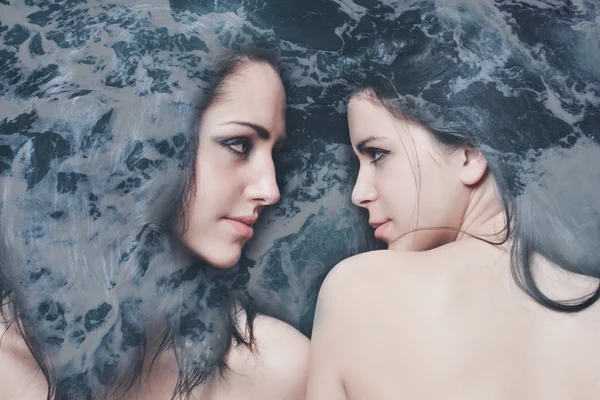 Double exposure of pretty girls and sea foam texture