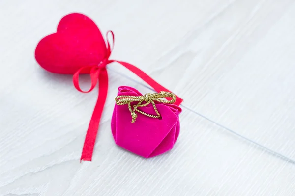 Valentines day gift box and hearts on wooden table with copy space, Valentines day