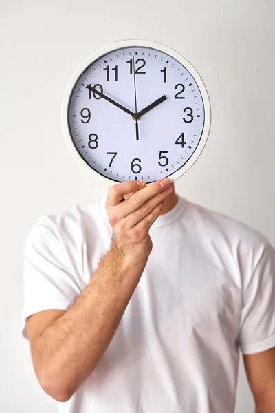 Man holding clock