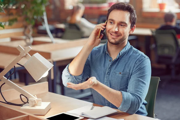 Handsome man talking on mobile phone