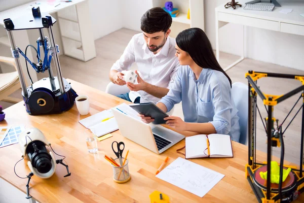 Positive colleagues working at the table