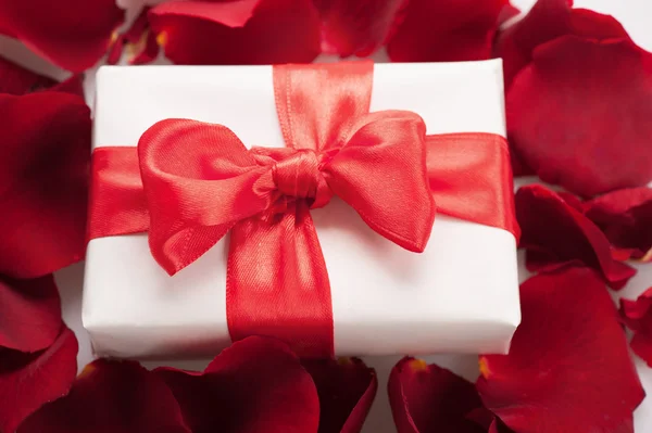 Present box in rose petals