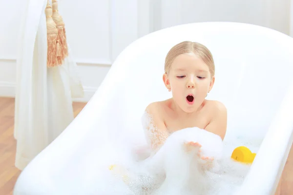 Cute little girl in the bathroom