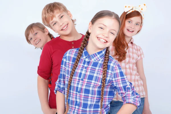 Brightly dressed children smiling