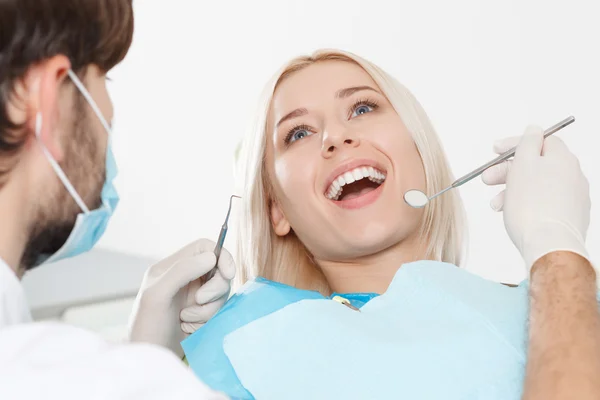 Woman during her teeth examination