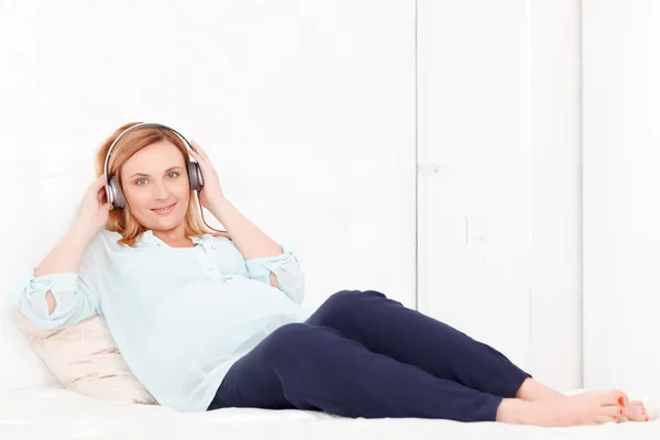 Pregnant woman listening music